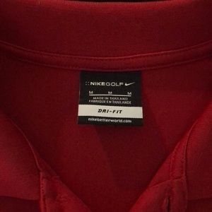 Red Nike golf polo.